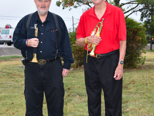 Darrell Anglin and Bill Cox played echo-taps during the lowering of the flag.