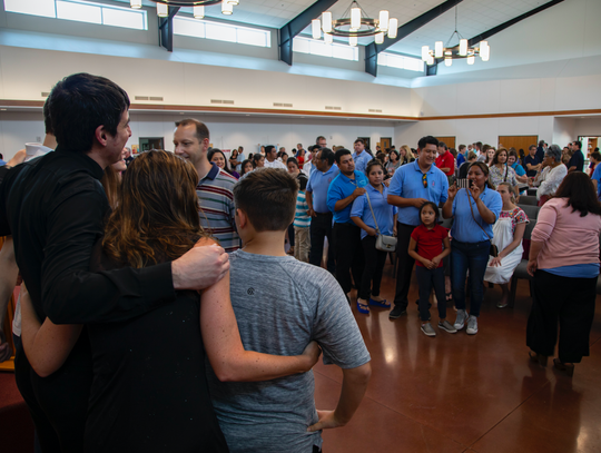 Parishioners say farewell to Fr Garza.