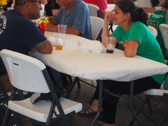 Far right, City Council Member Taline Manassian speaks with a fellow event attendee.