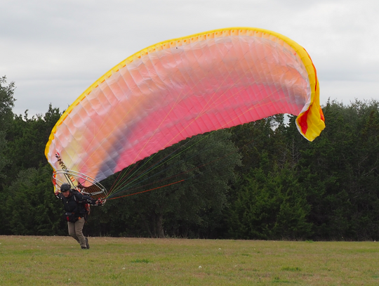 Dripping Springs' resident Oliver Reynold takes flight with his paramotor at Founder's Memorial Park, last Saturday afternoon.