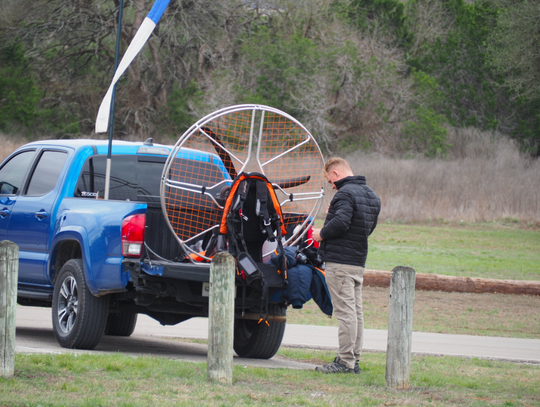 Checking his equipment prior to take off.