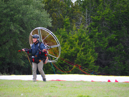 Gauging the wind one last time, Reynold prepares to create lift for his Paraglider.