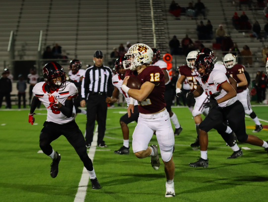 Running Back Curtis Cox runs the ball back against the Manor Mustangs.