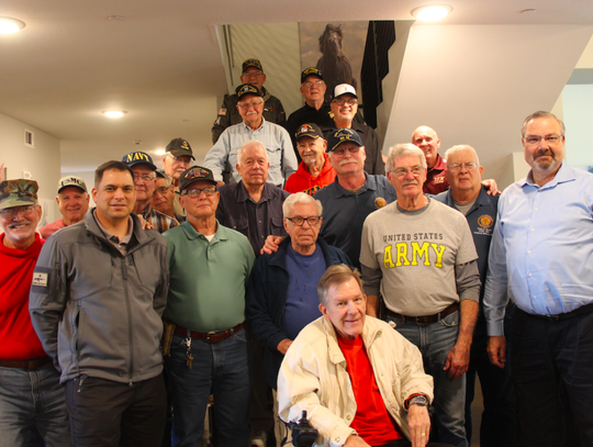 At the end of the lunch, nearly 20 veterans gathered to take a group photo together.