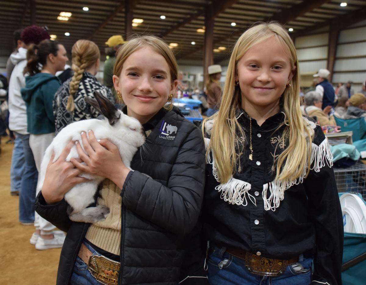 PHOTO BY LAURIE ANDERSON Wimberley 4-H members Sloane and Heidi hang out duri...