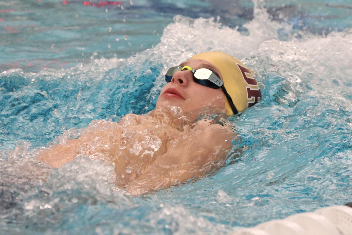 Freshman Jacob May swims the backstroke leg in the Boys 200 Individual Medley...