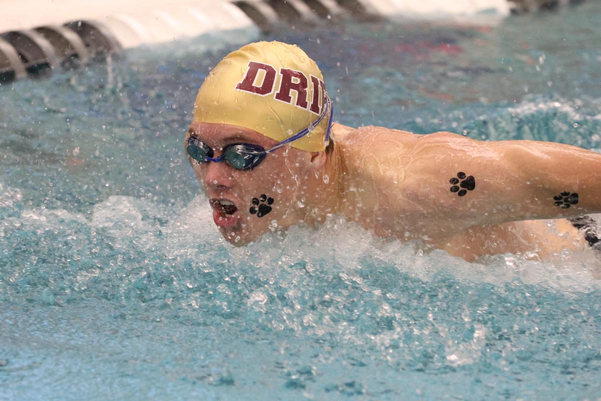 Sophomore Carson Woertink swims in the Boys 100 Butterfly. PHOTO BY JEFF MAY