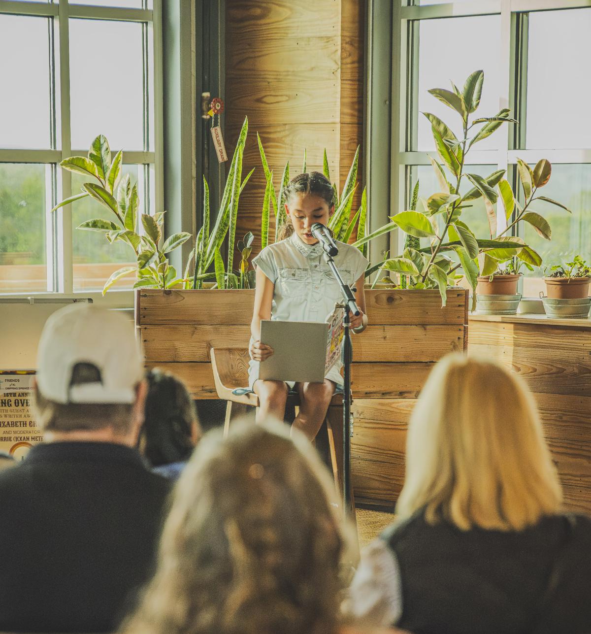 PHOTO BY JEREMY RASHAD BROWN Sabina Gonzales reads her book, “We Love You Liza.”