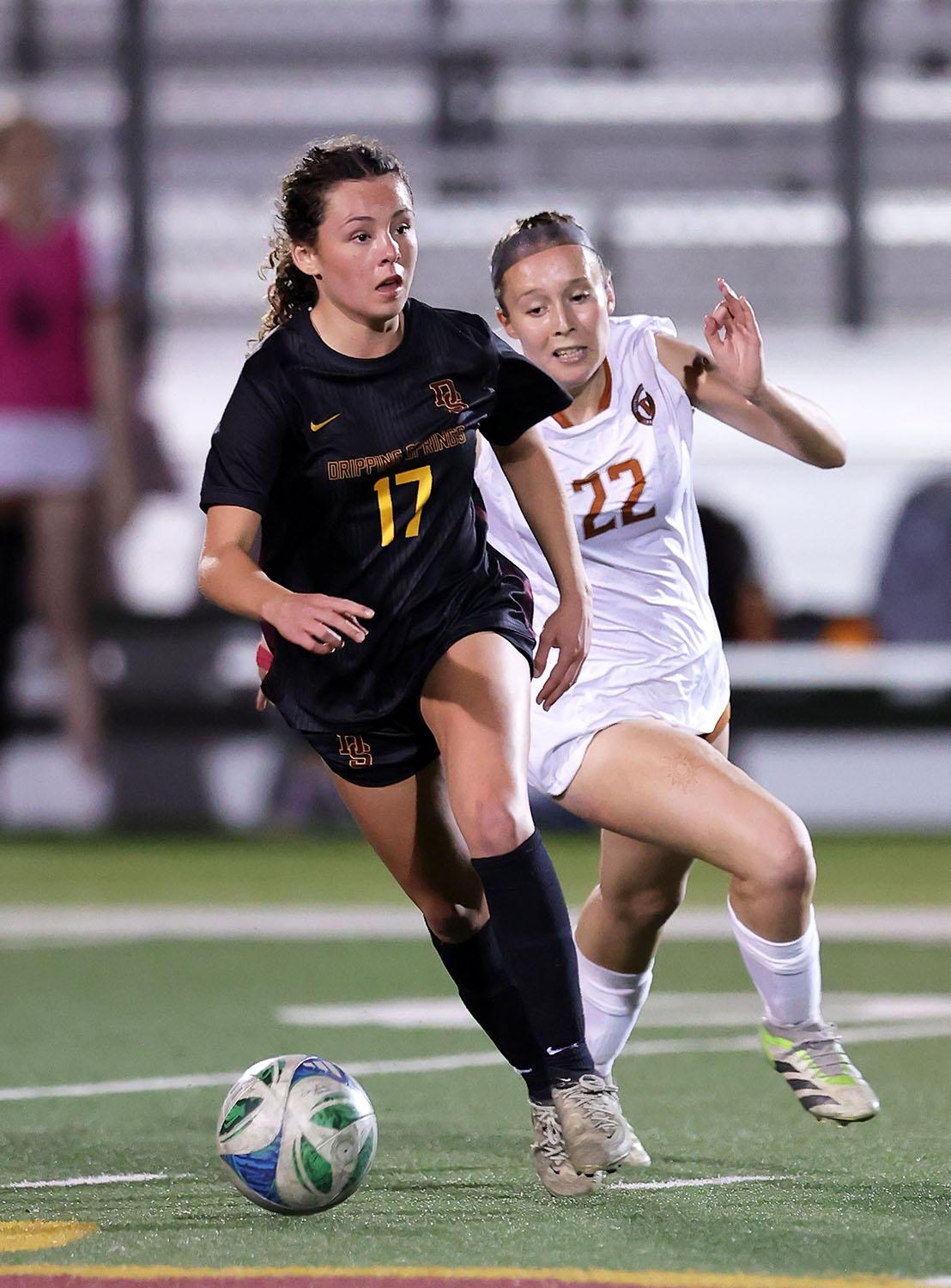 PHOTO BY VINCE CURLETTA Carson Thompson (#17) keeps the ball away from the We...