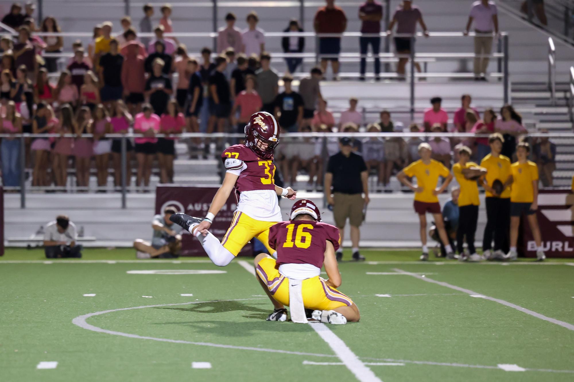 PHOTO BY CORTNI REID Ian French makes a kick, held by Pete Fredenburg.
