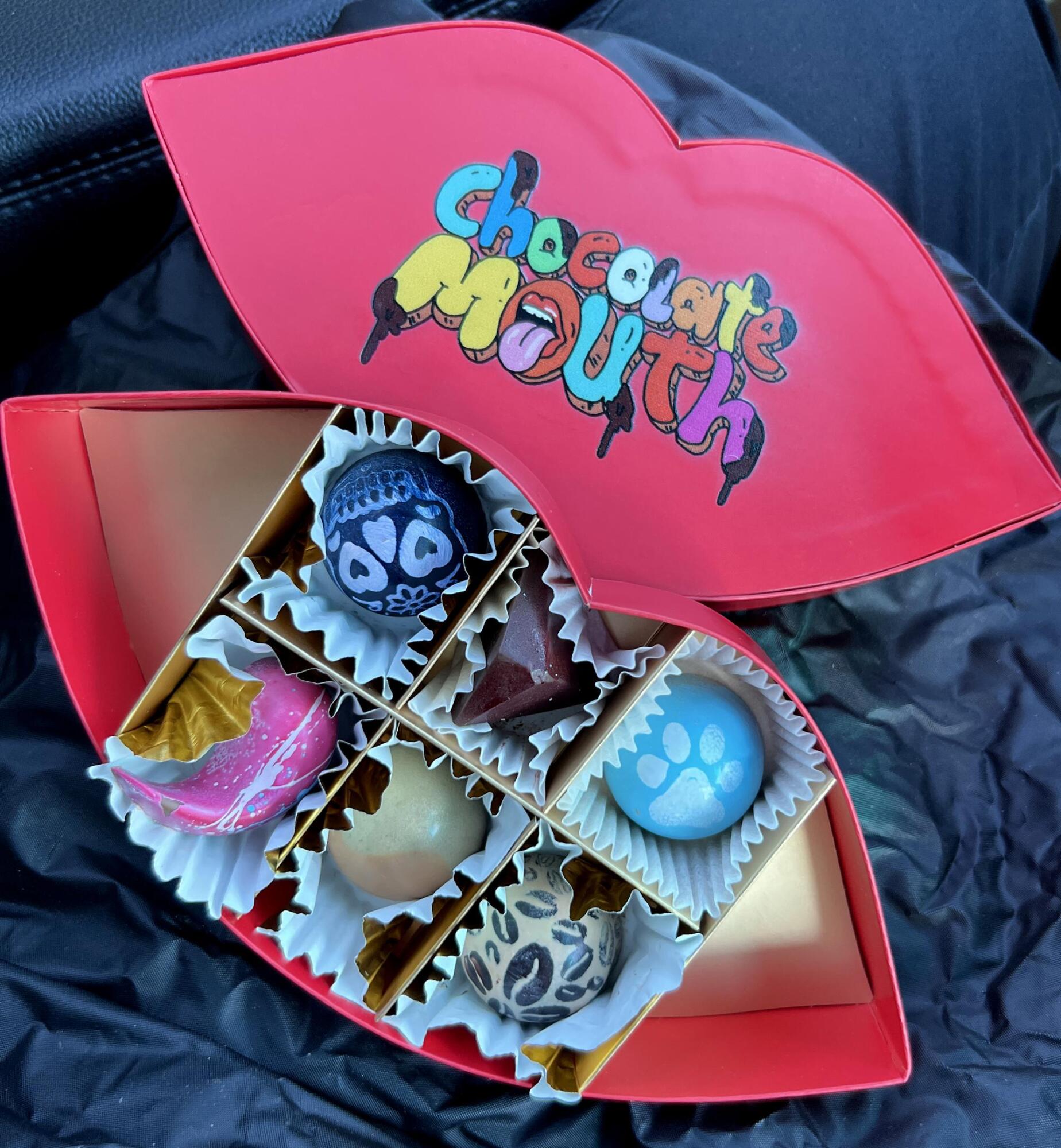 PHOTO BY LAURIE ANDERSON Bodhi Wilson’s chocolate creations are snug in their...