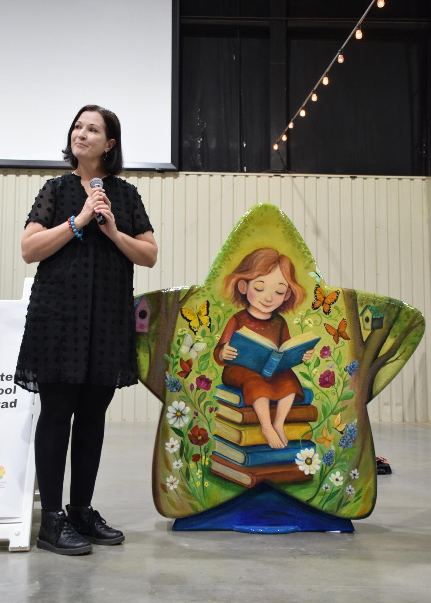 PHOTO BY LAURIE ANDERSON Tiffany Sierras with her creation, “Stacks of Belong...