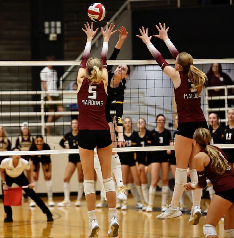 PHOTO BY DANIELA CABELA The Lady Tigers go to the net against the Maroons.