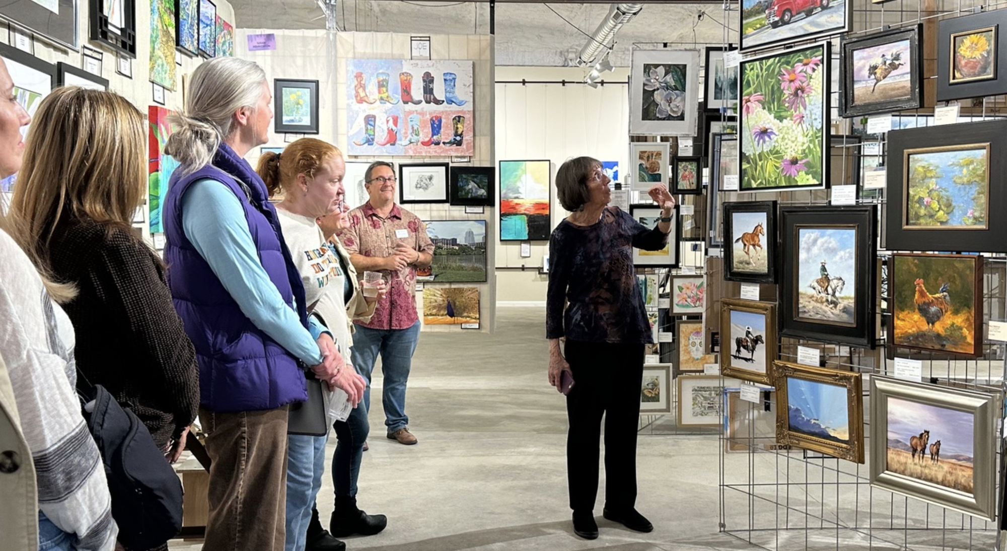 DSAL Artist Brenda Gibbs introduces her art to curious onlookers.