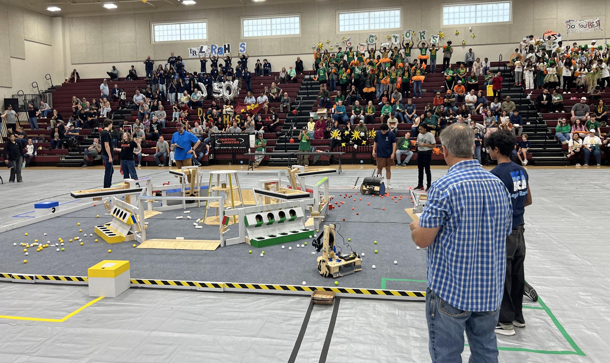 PHOTO BY LAURIE ANDERSON Teams compete in the Dripping Springs High School gym.