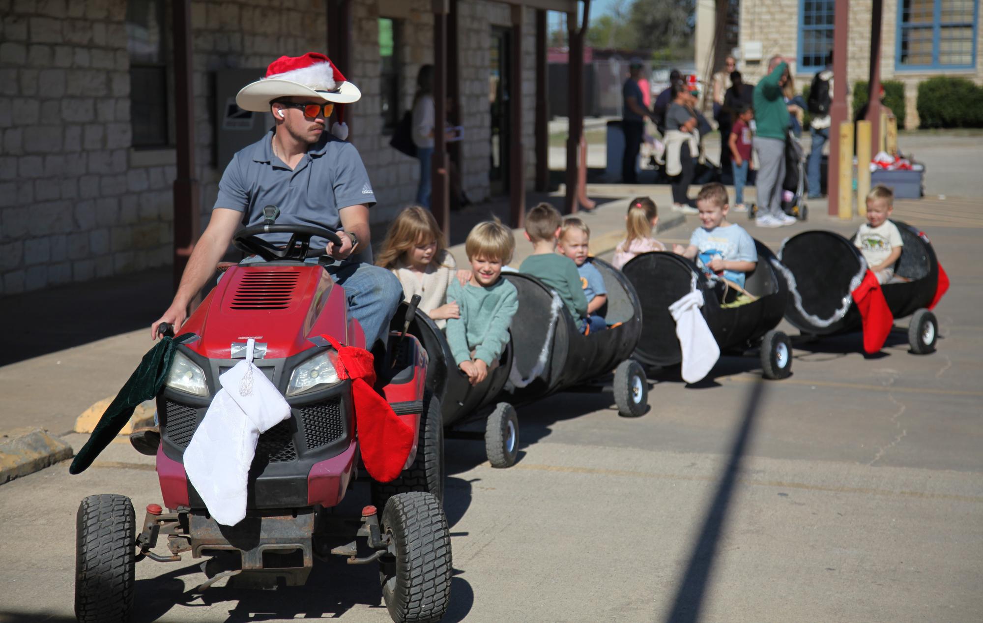 PHOTO BY LAURIE ANDERSON Children take a ride on the miniature train, courtes...