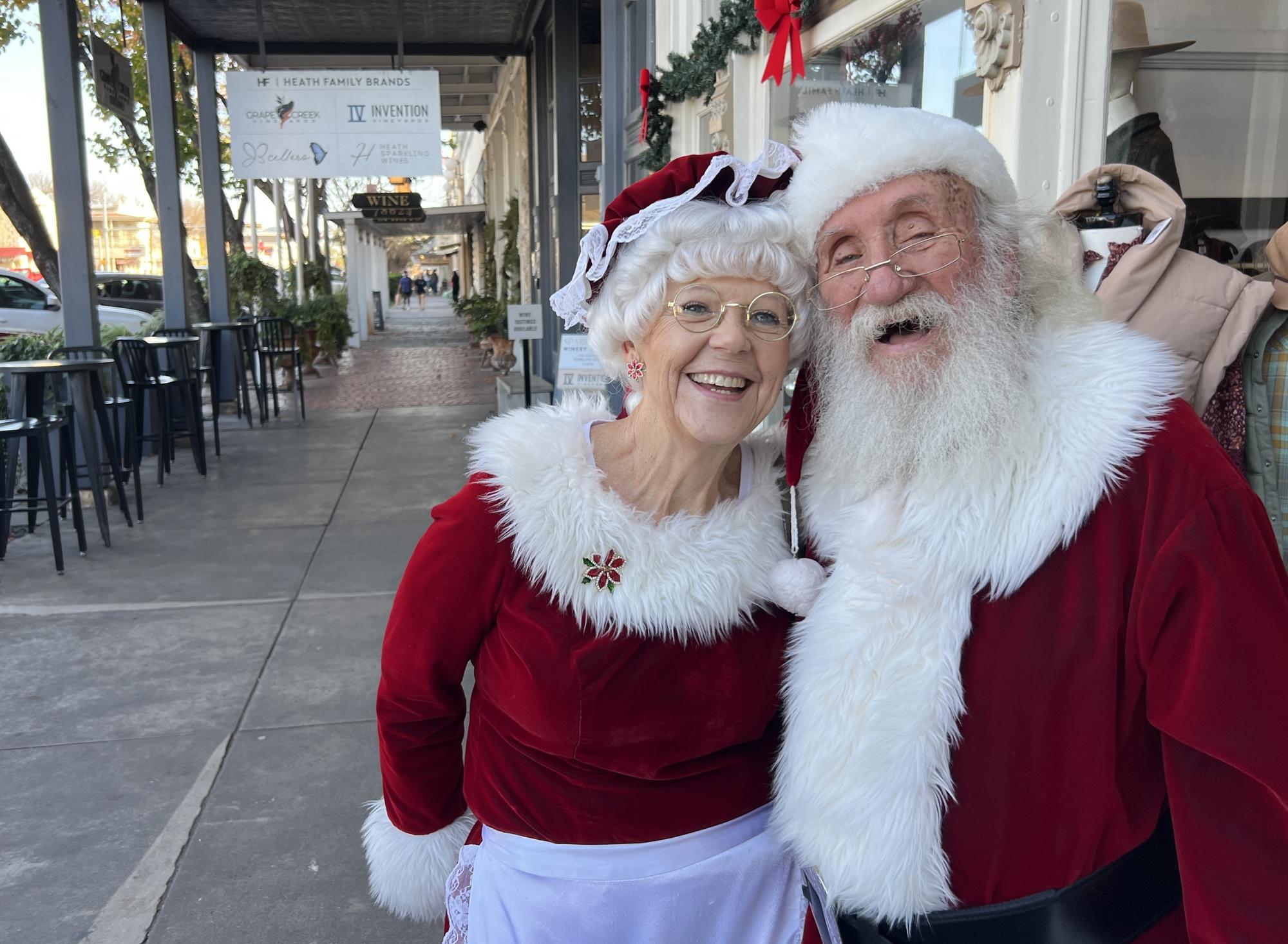 PHOTO BY LAURIE ANDERSON  Mr. and Mrs. Claus enjoy some shopping.